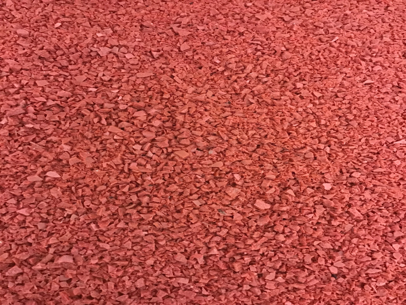 Photo of PET Red Regrind - Post Consumer Recycled Material